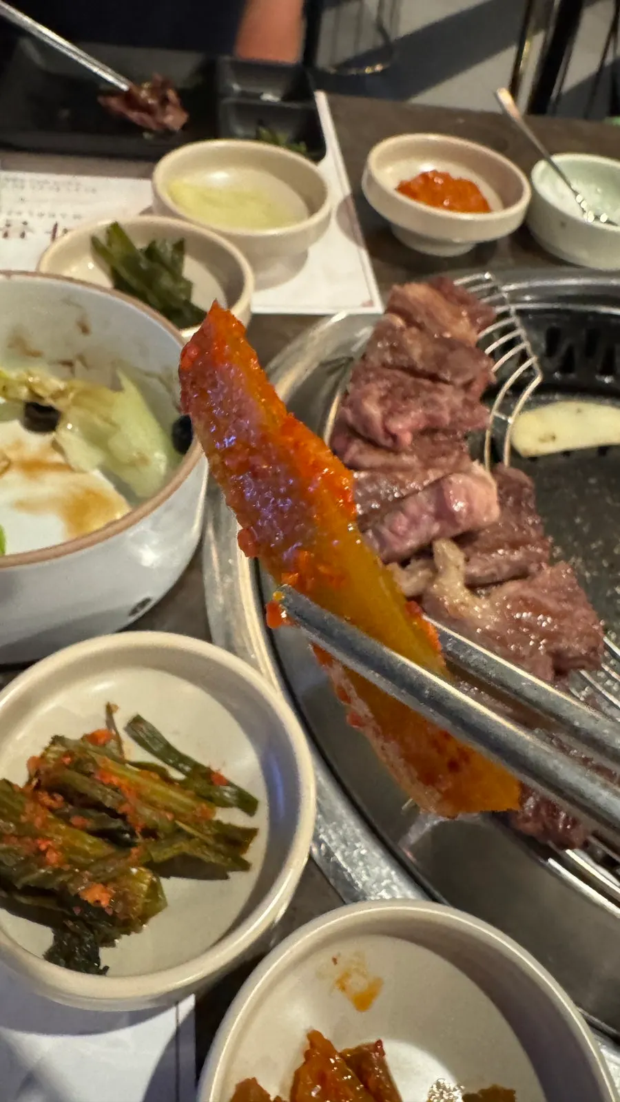 Two-plus Korean beef mixed grill cooking on the grill