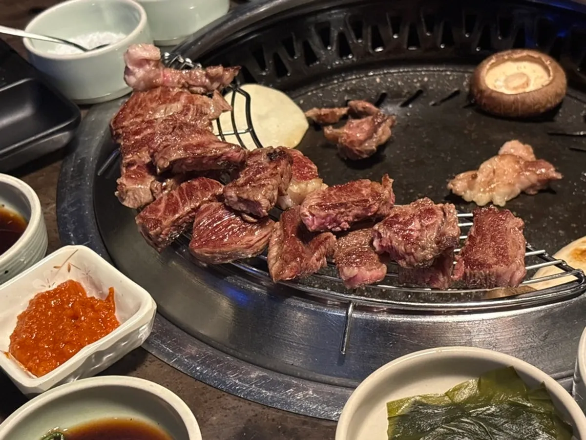 Top-grade Korean beef with juices glistening on the grill