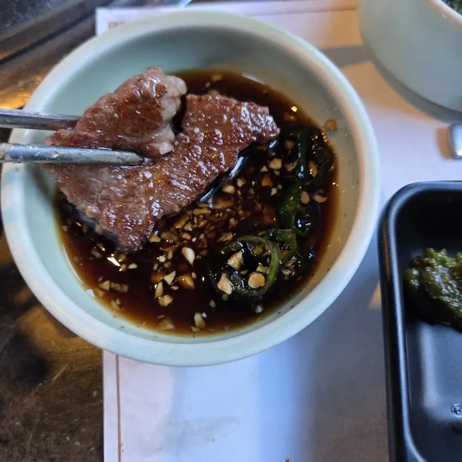 A glistening piece of grilled brisket point