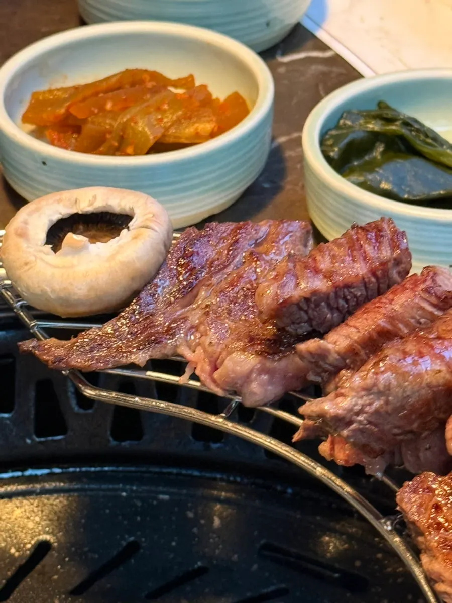 Staff grilling Korean beef at a steady pace