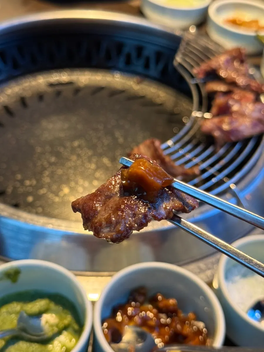 A piece of Korean beef topped with shiitake mustard