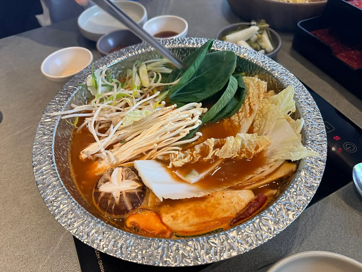 Spicy mushroom shabu with Hanwoo boseopsal spread
