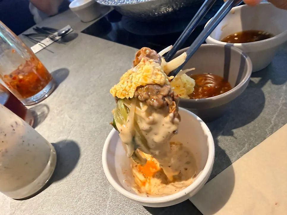 Three dipping sauces including sesame sauce and soy sauce