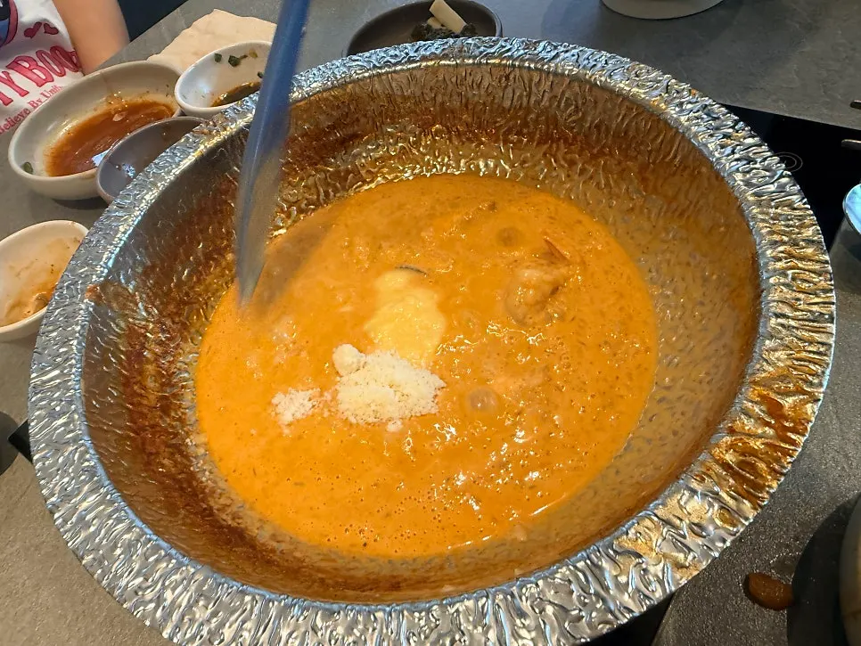 Rosé risotto with cream and cheese added