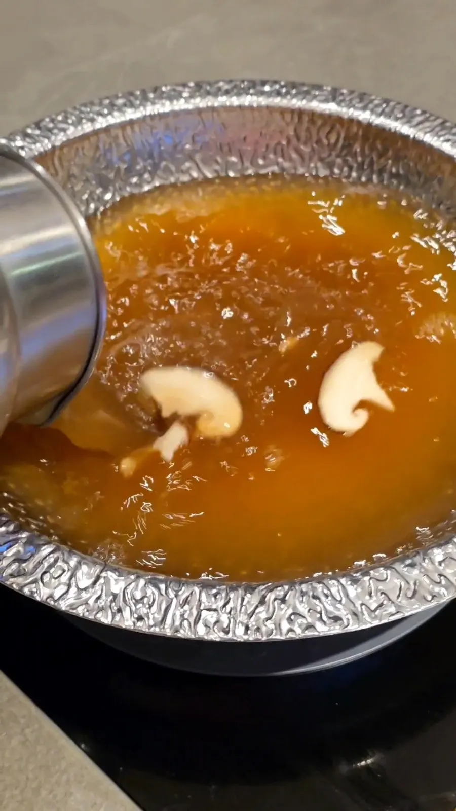 Shabu-shabu pot filled with broth