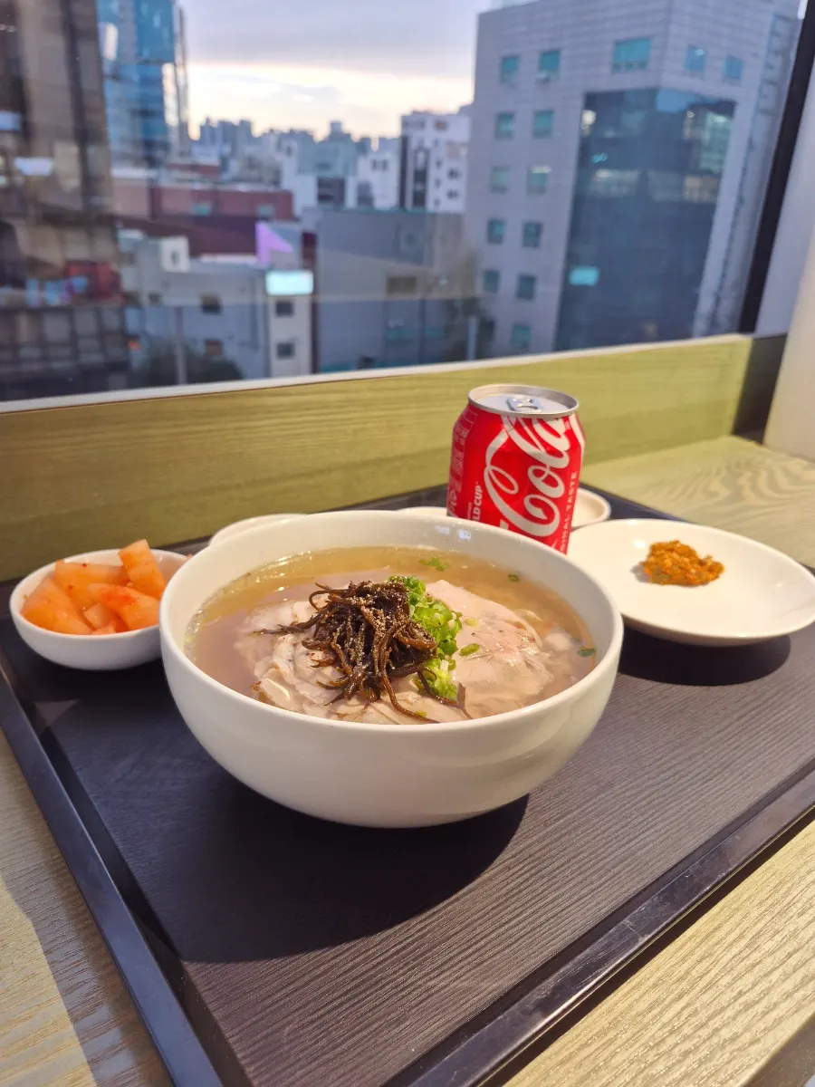 A bowl of House Clear Gomtang with rice inside