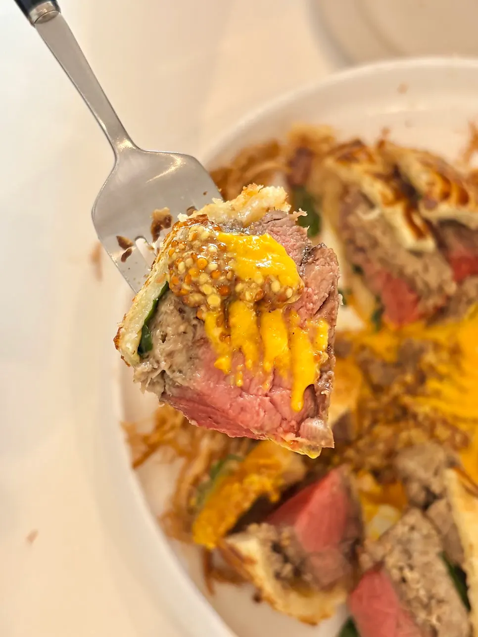 Bite-sized beef Wellington slices with corn puree