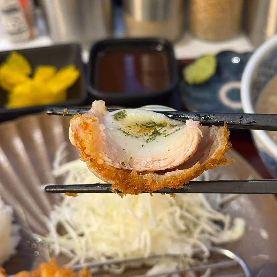 Cross-section of cheese katsu with melting cheese