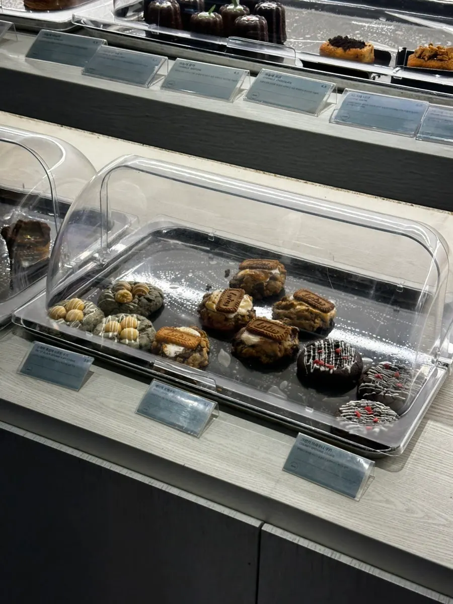 Bakery case with vegan cookies and muffins