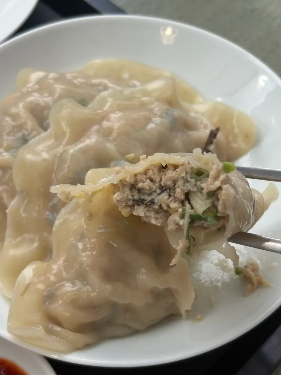 Giant mandu split in half showing the filling
