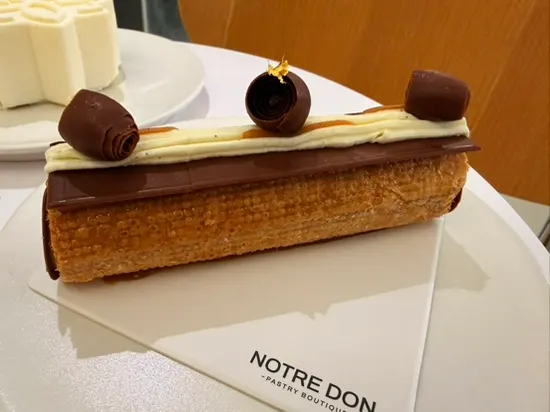 Salted Caramel Mille-feuille topped with chocolate decoration