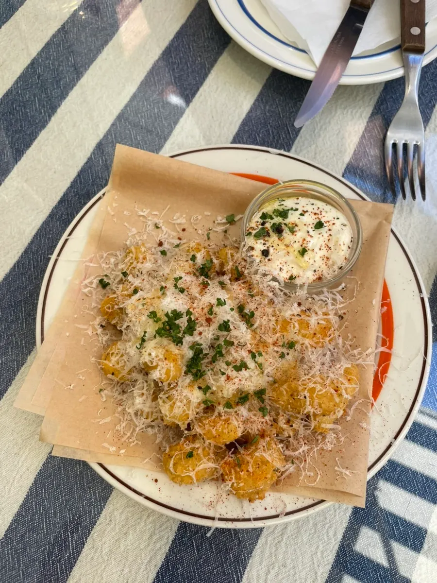 Gnocchi frittes topped with cheese