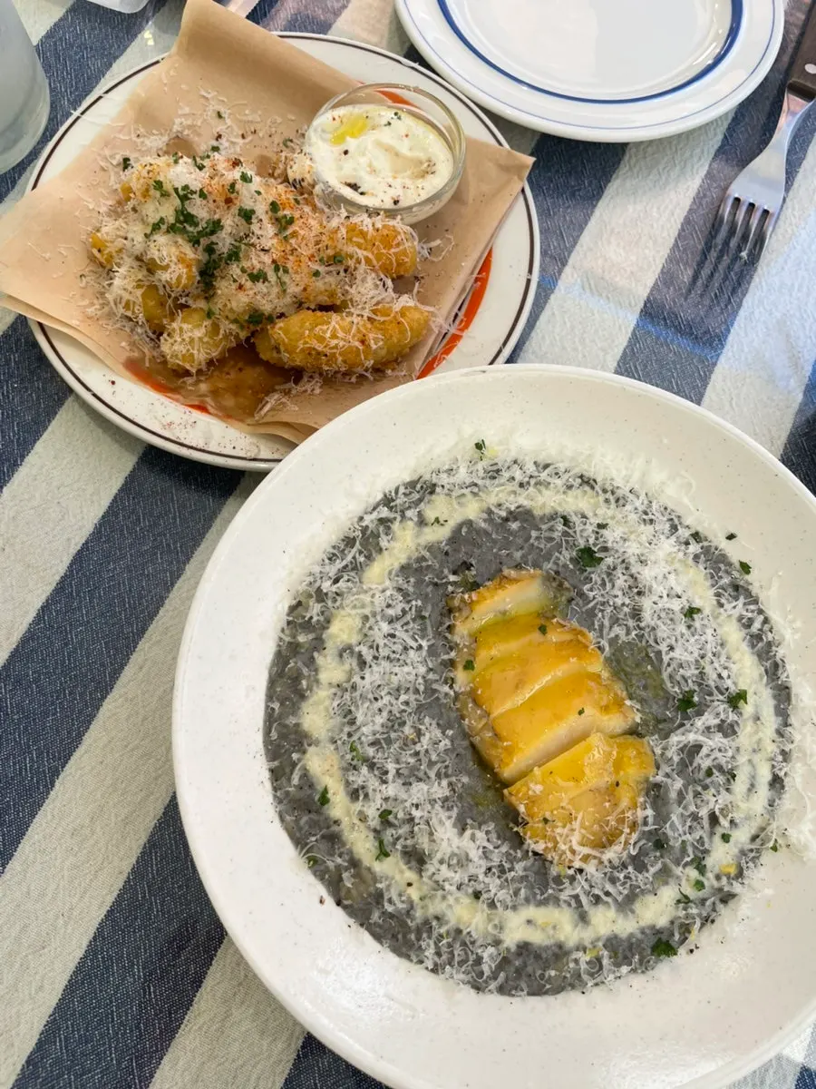 Squid-ink risotto topped with abalone
