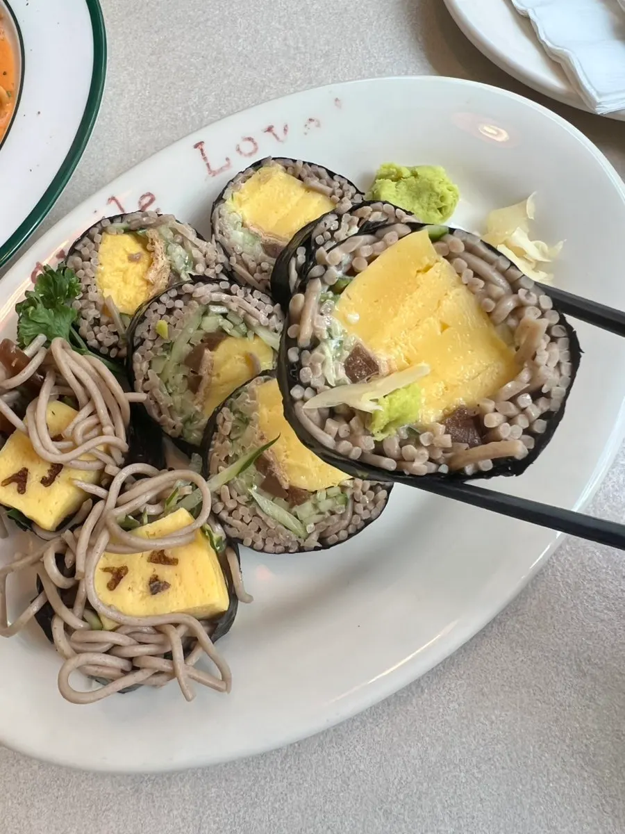 Omil Sobayaki served with wasabi and pickled ginger