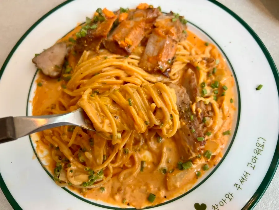 Gochujang butter pasta mixed and twirled with sauce