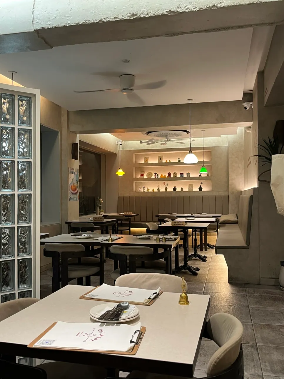 Neatly set table at Omil Seongsu under soft lighting