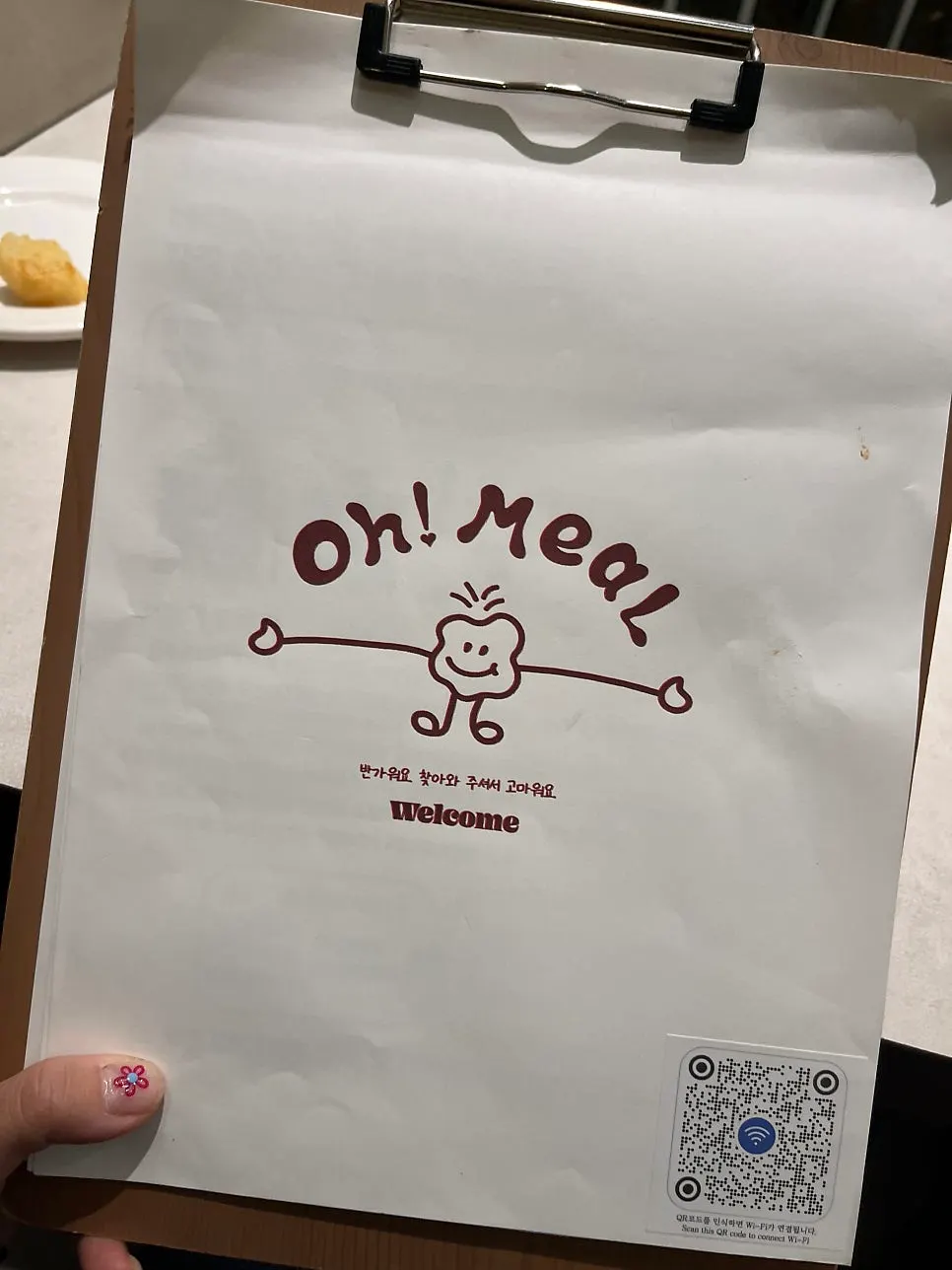 Omil Seongsu menu cover with the Wi-Fi password written on it
