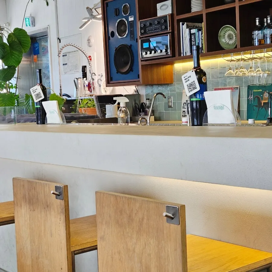 Bar seating with a bag hook at Out of Order Seongsu