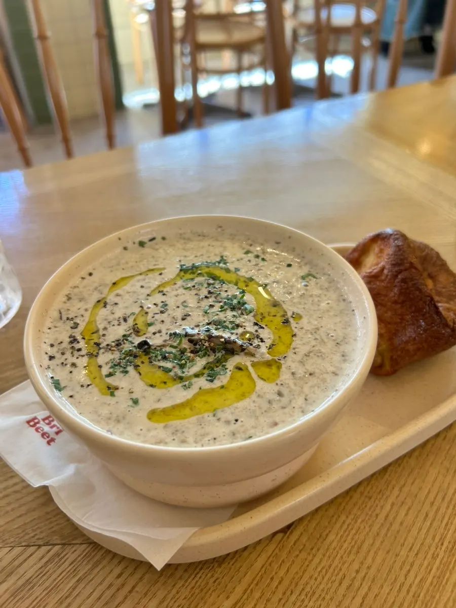 A bowl of mushroom soup made with whole mushrooms