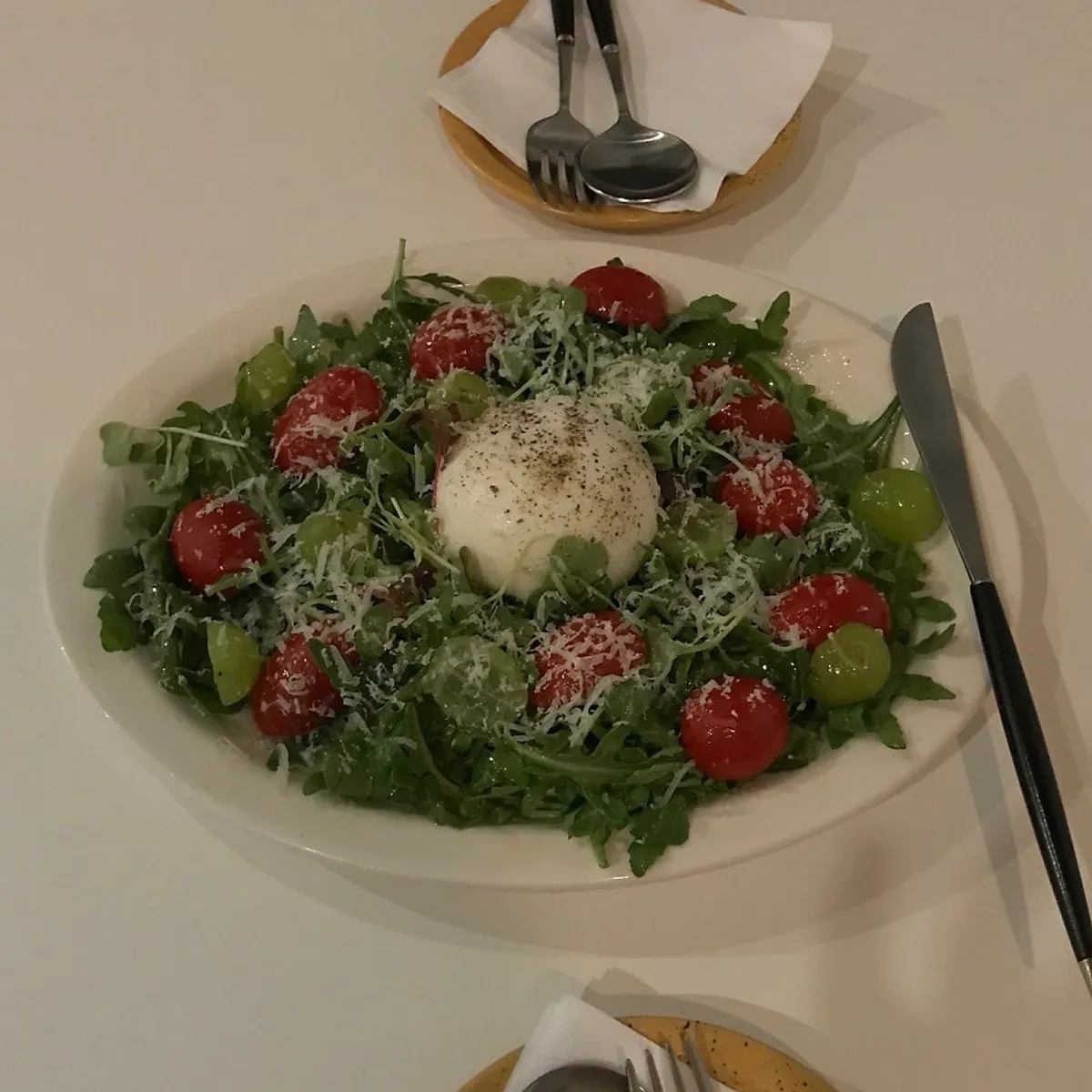 A plate of Huirit's burrata cheese salad