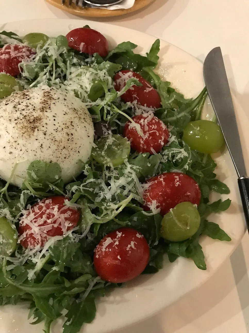Burrata salad with tomato and green grapes