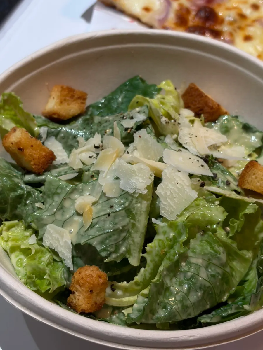 Caesar salad topped with cheese
