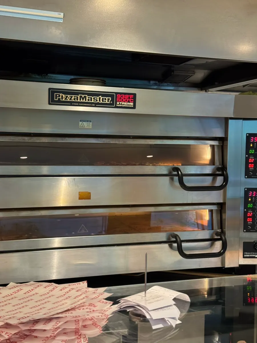Slice pizzas baked fresh on-site