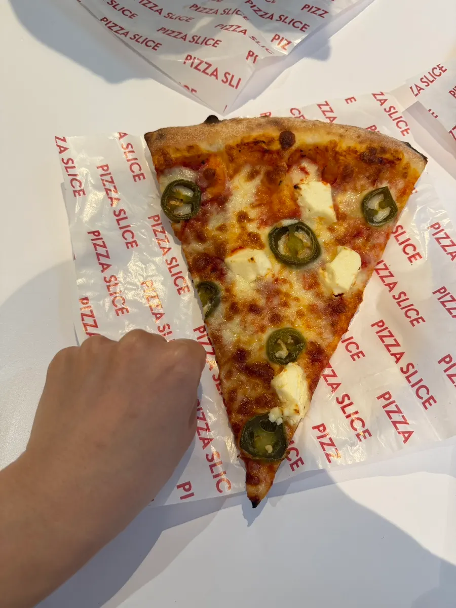 Three pizza slices placed on the table