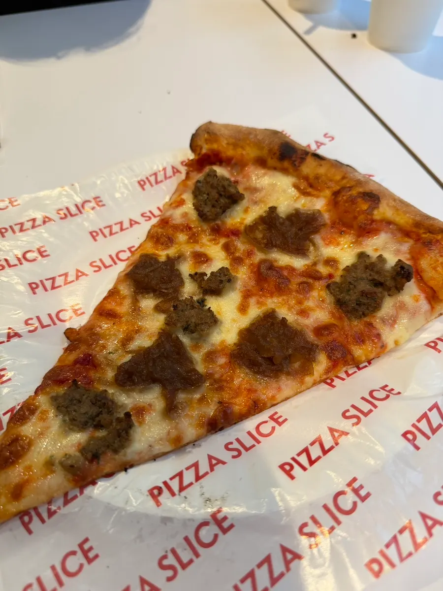 Jalapeño-studded white cream cheese pizza slice