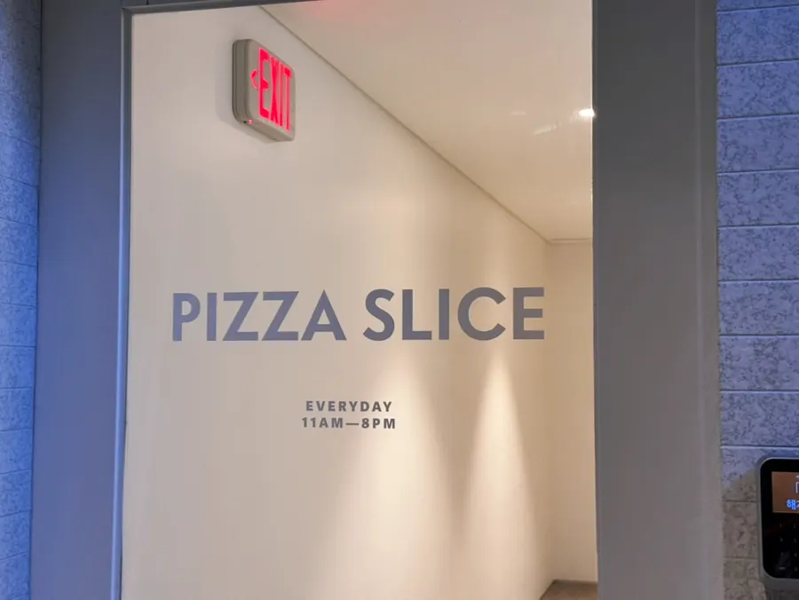 Store entrance with posted business hours