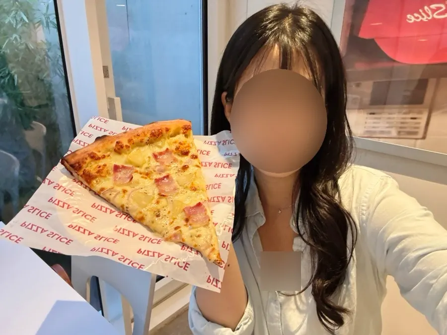 Jumbo-sized slice bigger than a face
