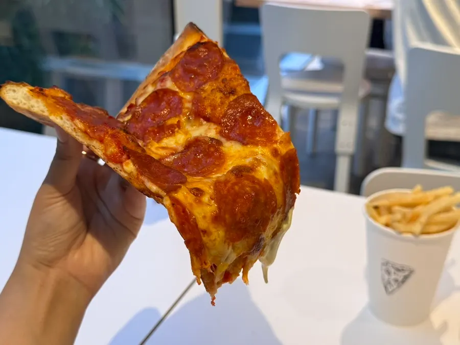 Cross-section of a bitten pepperoni slice