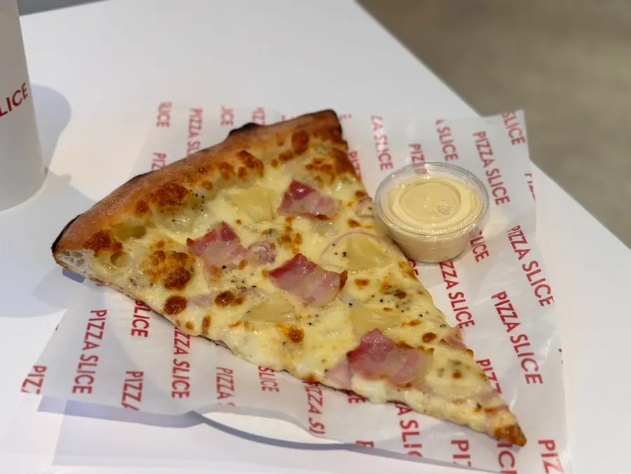 White Hawaiian pizza topped with pineapple