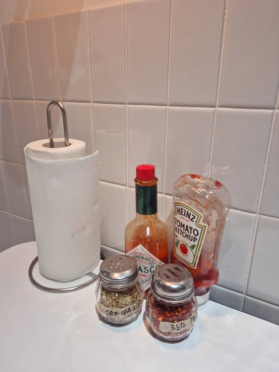 Table set with napkins and hot sauce