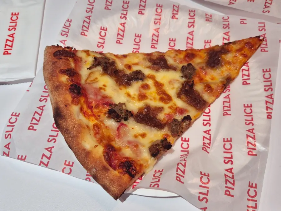 Size comparison of a slice bigger than a palm