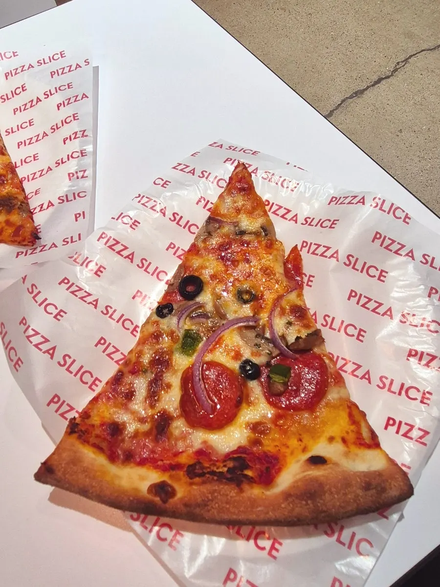 A slice of pizza lifted up