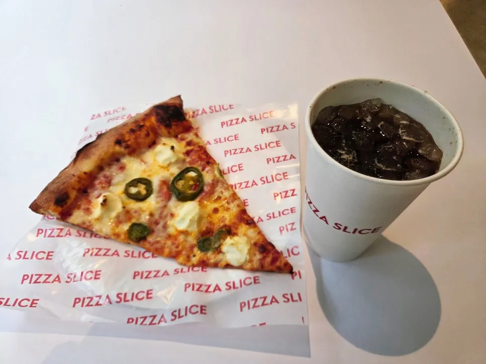 Jalapeño & cream cheese slice with a Coca-Cola Zero