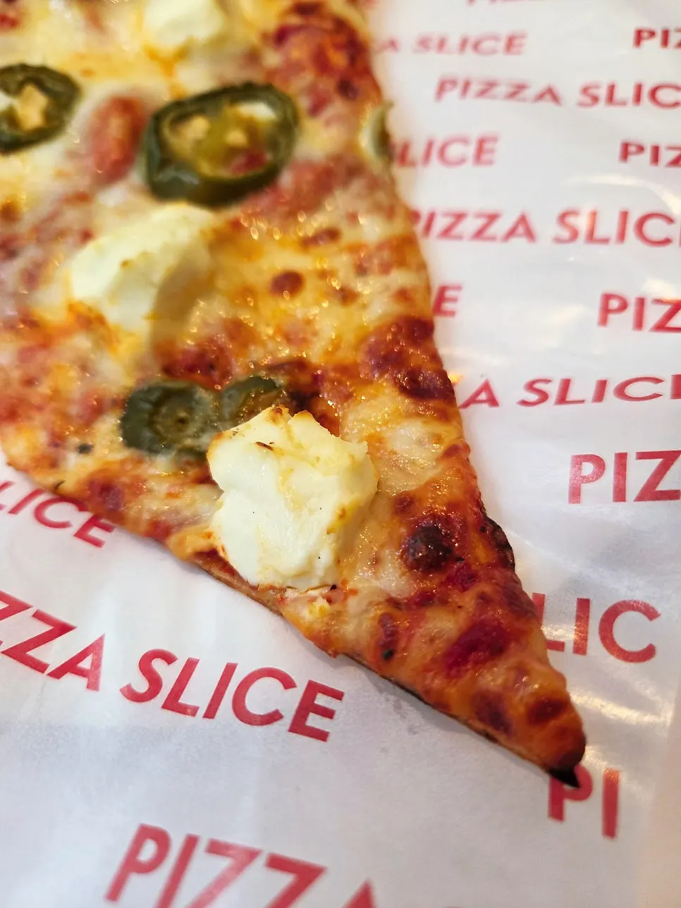 Freshly reheated jalapeño & cream cheese slice