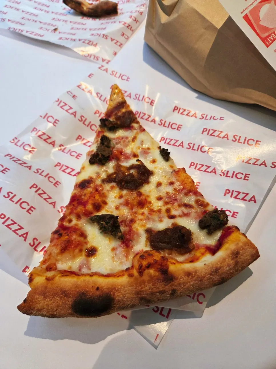 A slice of the homemade meatball pizza