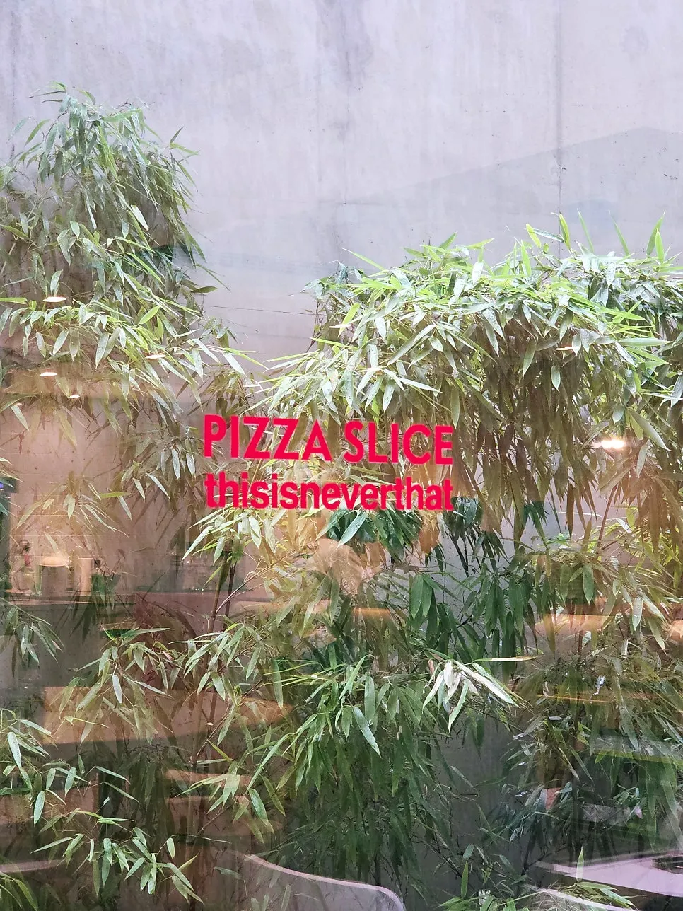 Pizza slice on a table set for solo dining