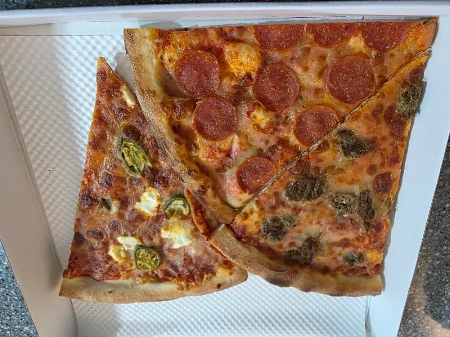 Neatly packed slice pizza takeout box