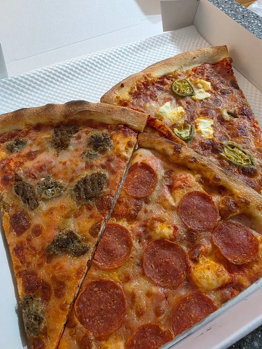 Takeout pepperoni pizza slice