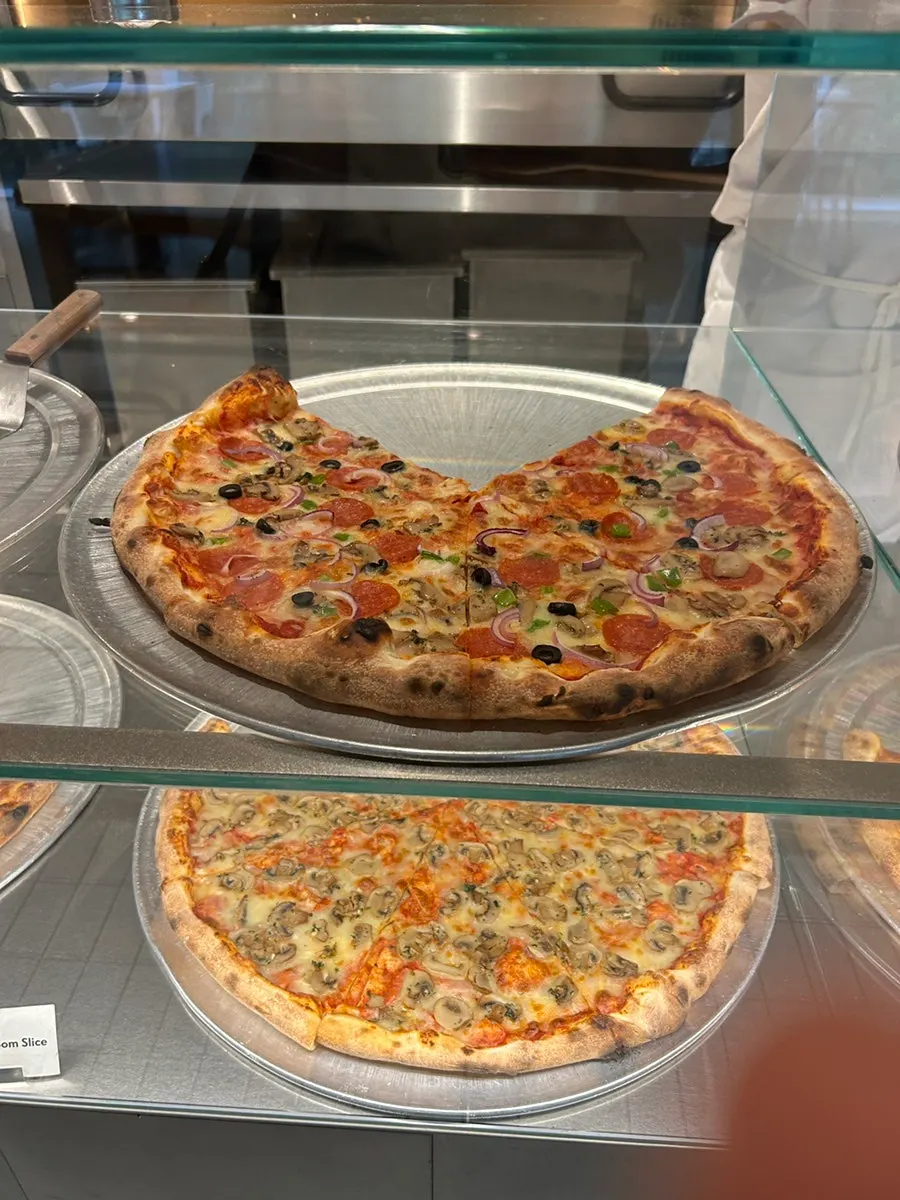 A pizza slice served on a plate