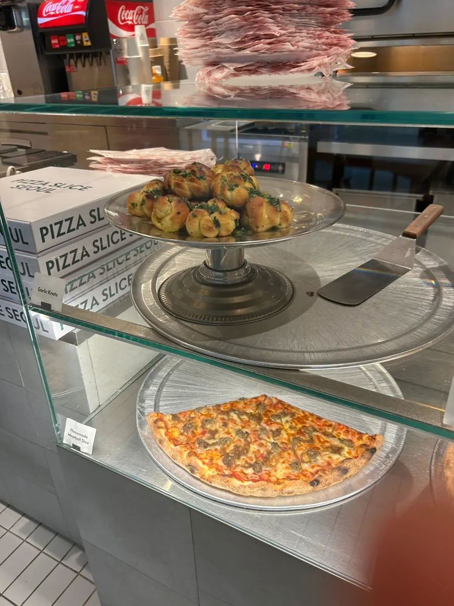 A freshly baked pizza slice from Pizza Slice Seoul