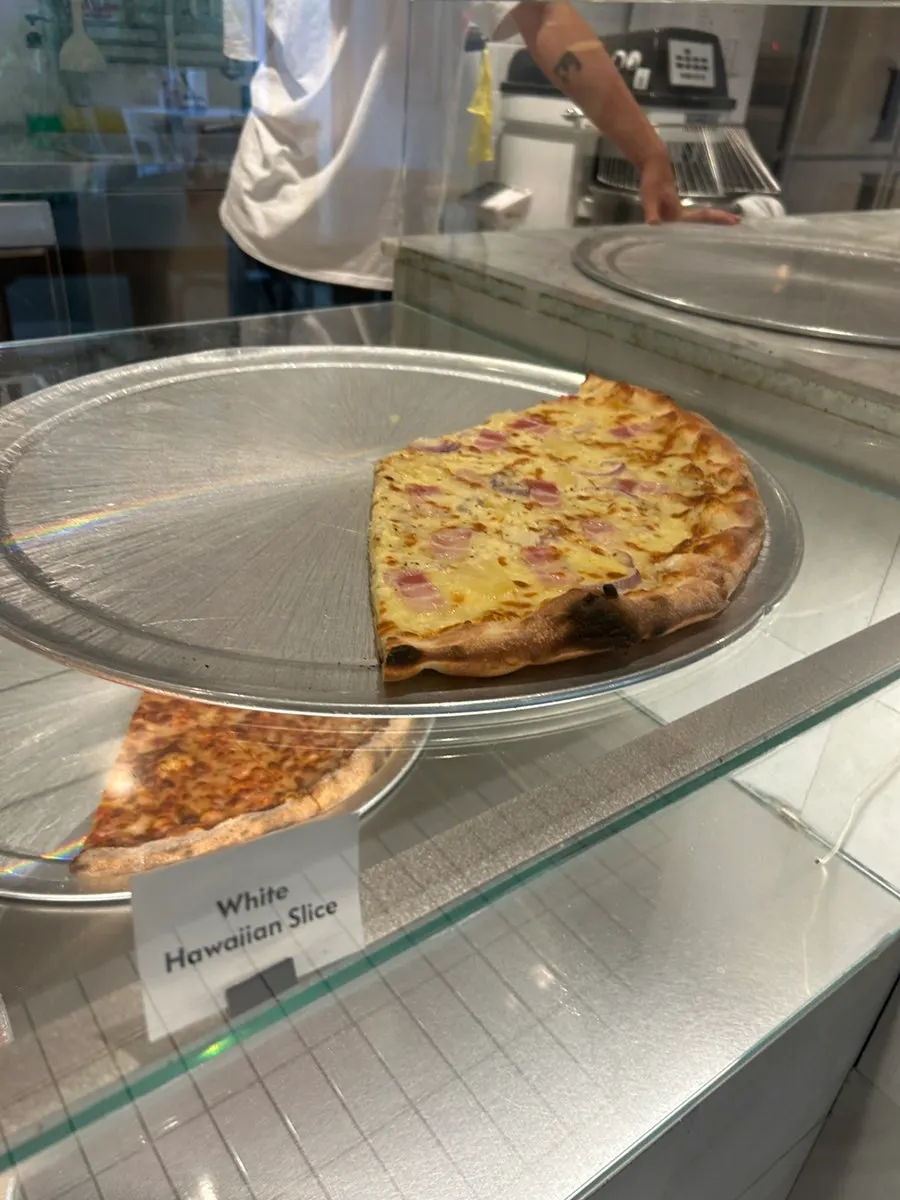 Pizza slices set out on the table at Pizza Slice Seoul
