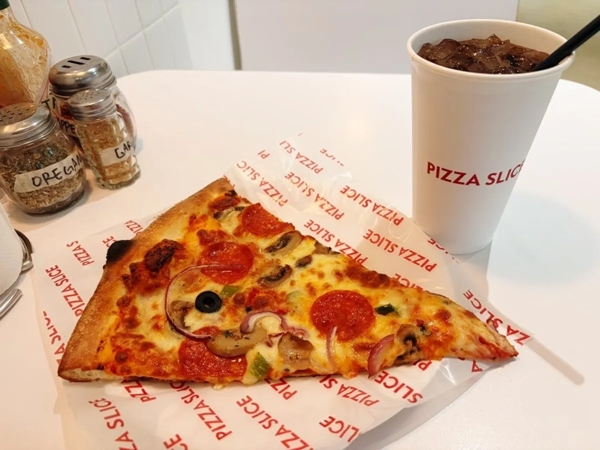 Today's Slice pizza and Dr Pepper Zero on a paper plate