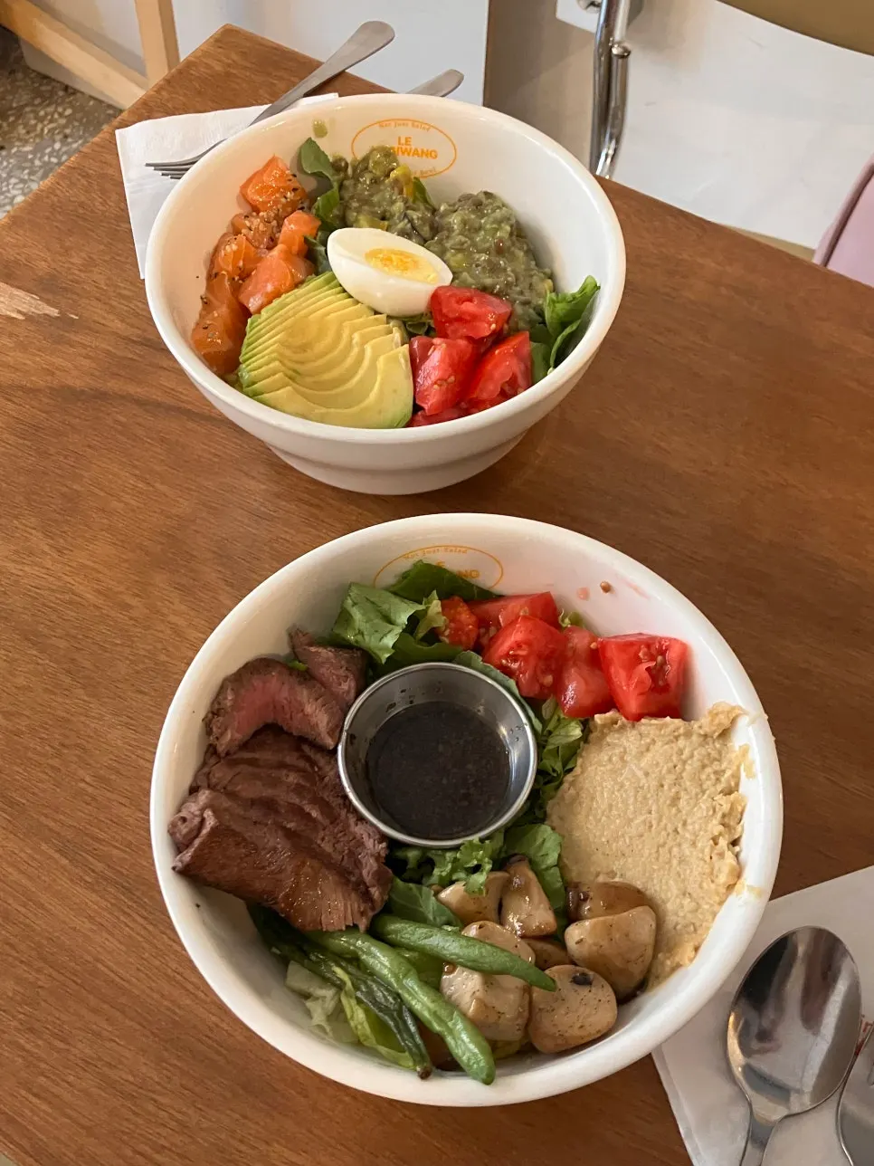 Both poke bowls placed together on the table