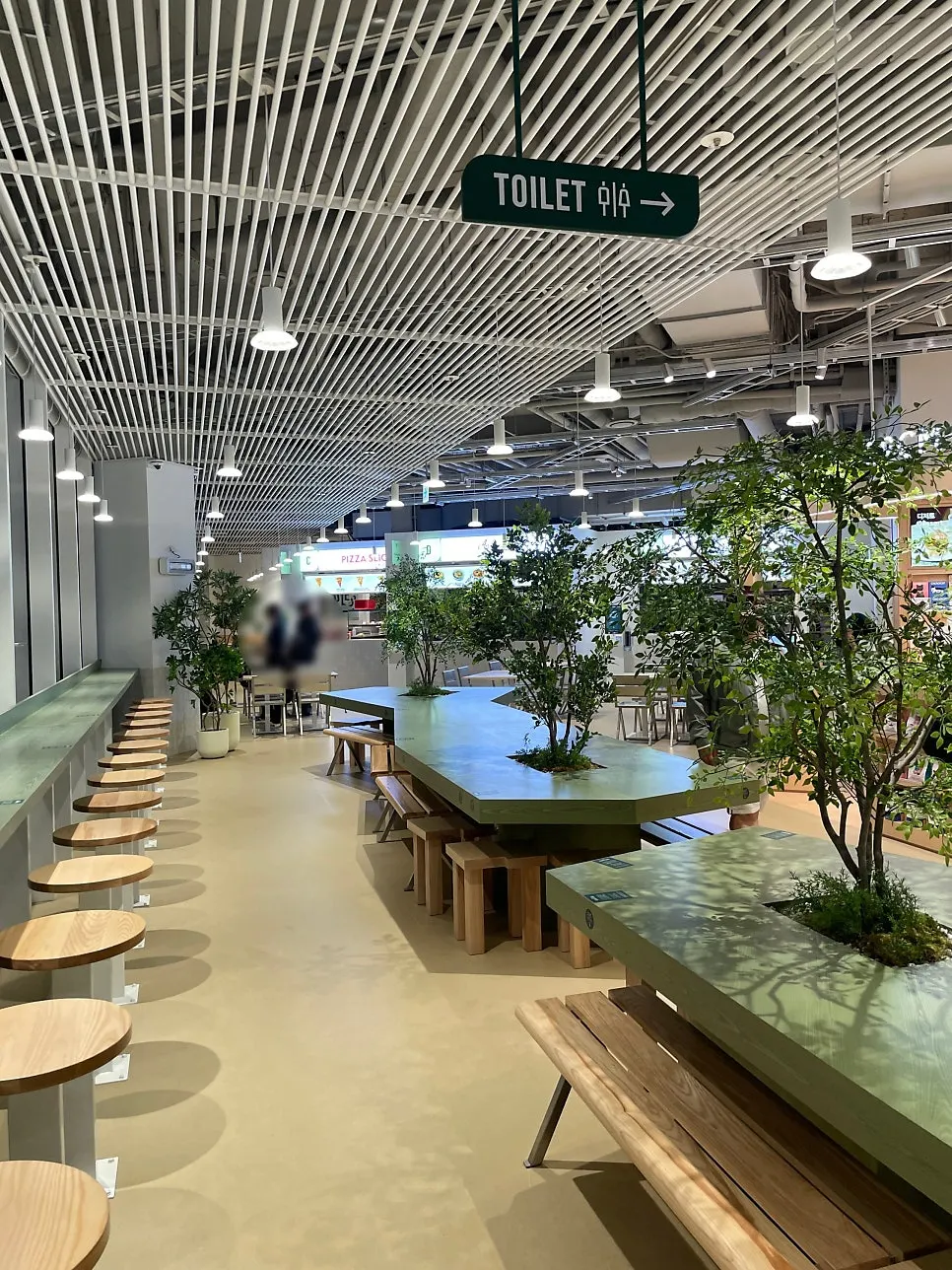 Interior of Dwaeji Gomtang House and seating in the pop-up zone