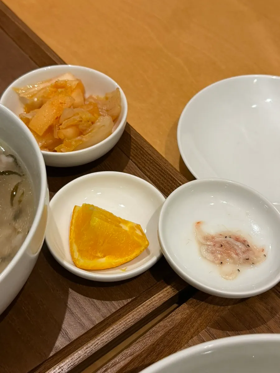 Basic side dishes: dadaegi, kimchi, orange, and salted shrimp