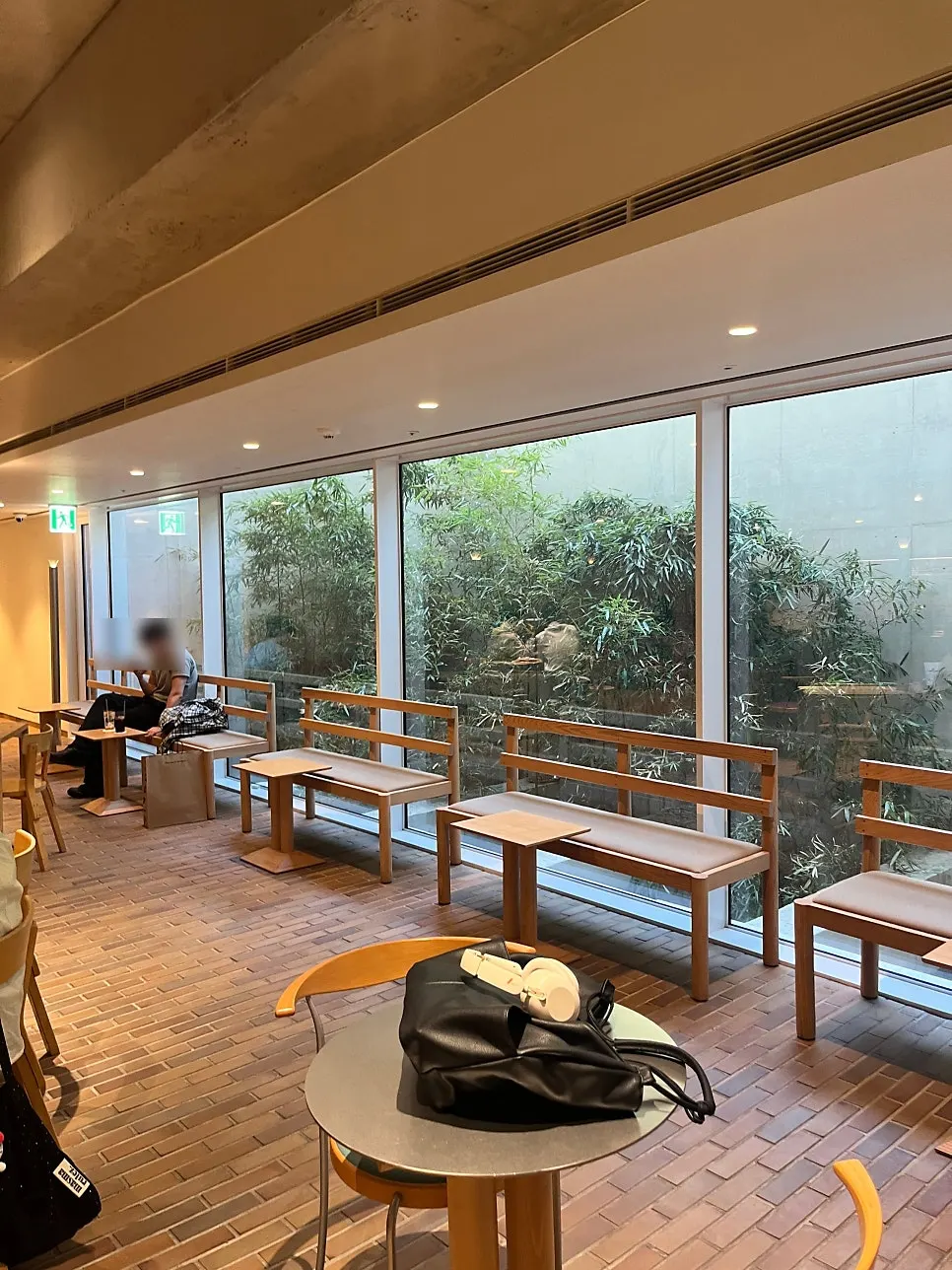 Window bench seats overlooking a bamboo garden